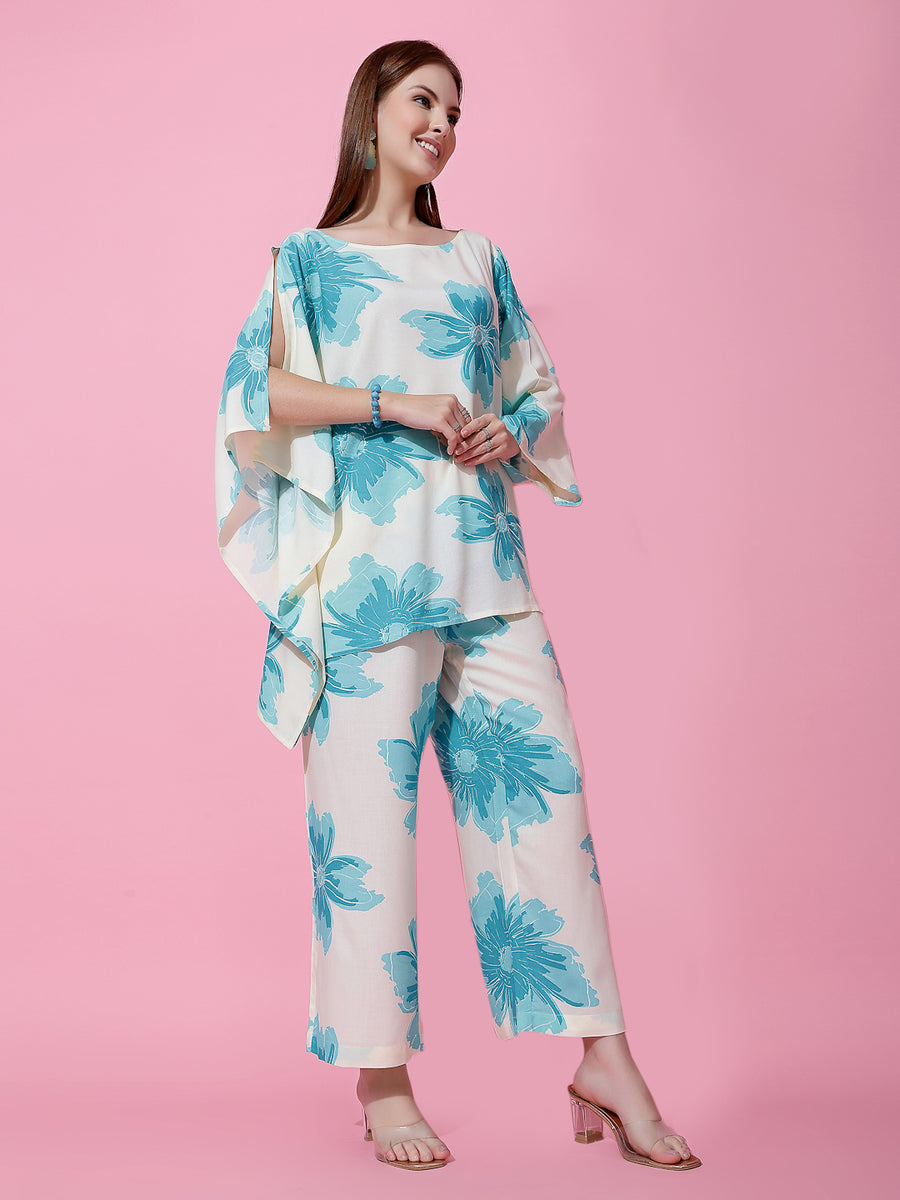 Women's off-white co-ord set with bold turquoise blue floral print and flared sleeves